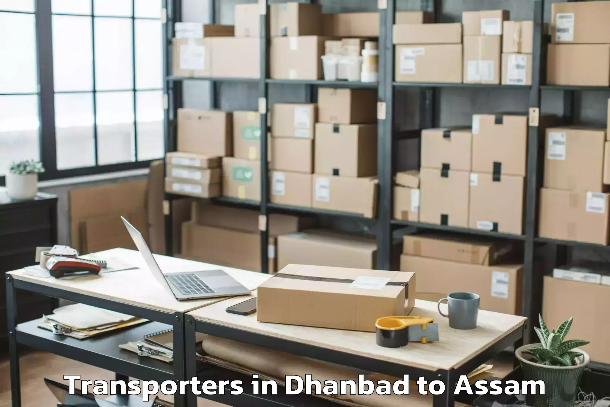 Reliable Dhanbad to Dokmoka Transporters